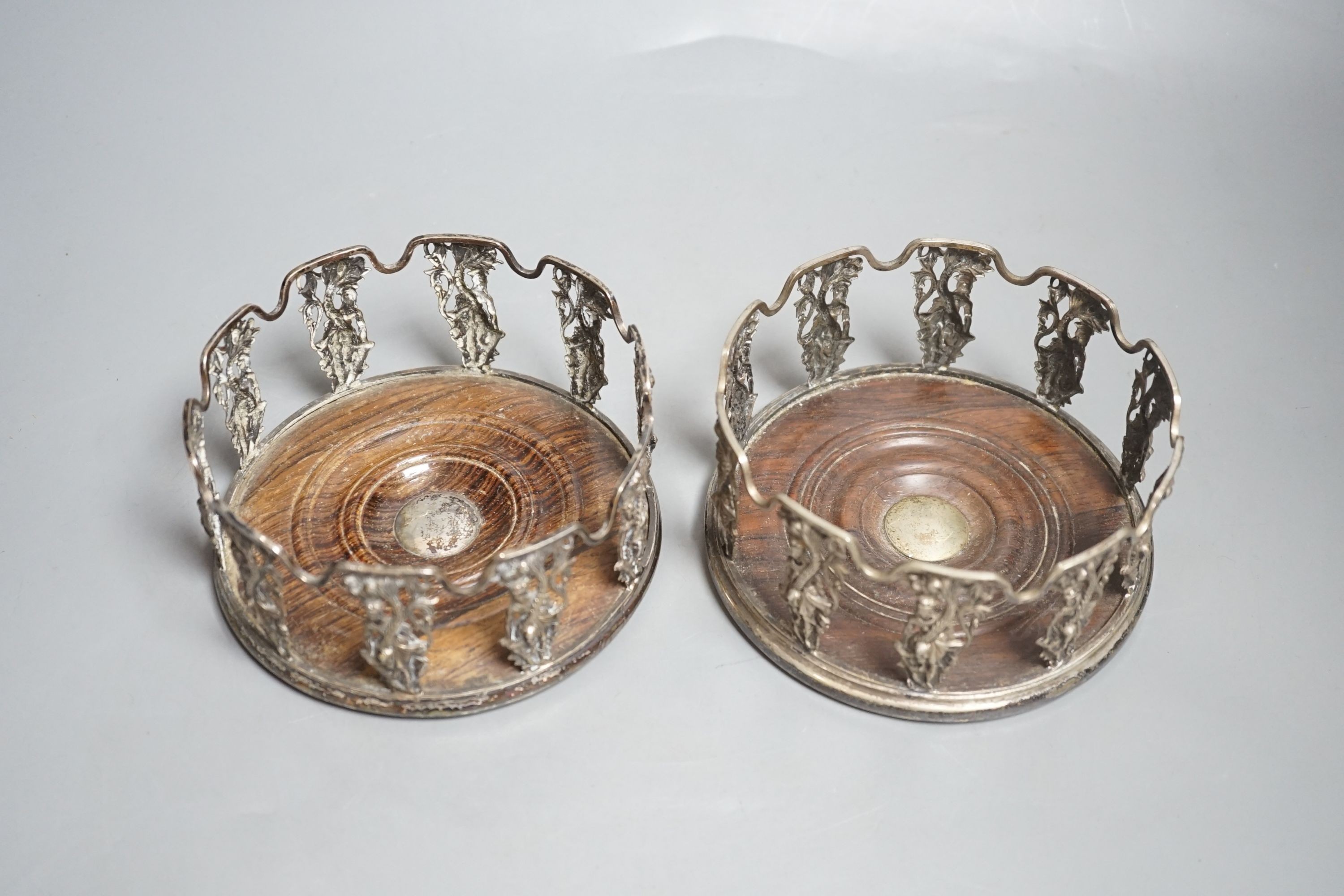 A pair of 19th century Anglo-Indian silver plated figural wine coasters.